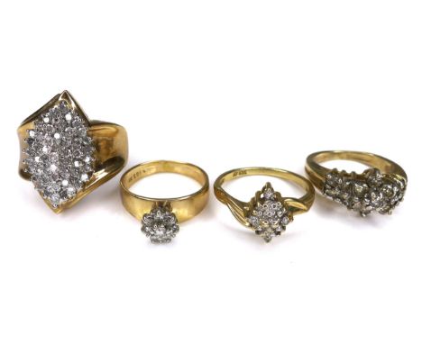 A group of four 10K gold and diamond set rings, comprising one set with a cluster of small stones in marquise shape, 23mm hig