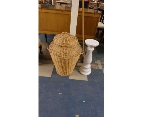 A Wicker Alibaba Laundry Basket and Ceramic Jardiniere Stand 