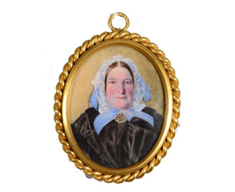 ENGLISH SCHOOL (LATE 19TH CENTURY) A miniature oval portrait of a lady wearing a lace trimmed blue bonnet, watercolour on ivo