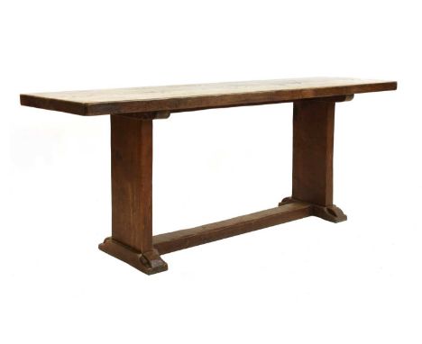 A Robert 'Mouseman' Thompson dining table,c.1930, the adzed rectangular two-plank top, raised on adzed supports, these on sha