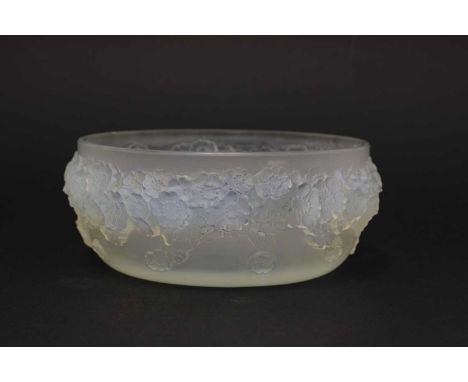 A Lalique 'Primeveres' opalescent glass bowl,moulded with flowers, impressed 'R Lalique' and wheel cut 'France',16cm diameter