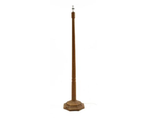 A Robert 'Mouseman' Thompson oak standard lamp,with an octagonal turned column, the plinth carved with the signature mouse,14