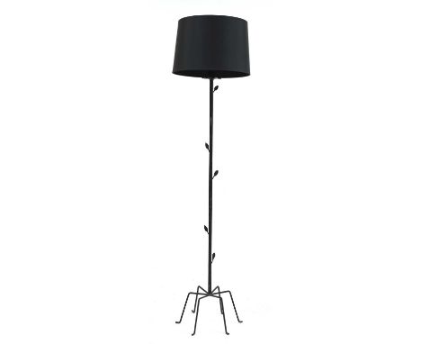 A standard lamp,with leaf details to the column, raised on six spider legs, with a shade, 160cm high Condition report: Some m