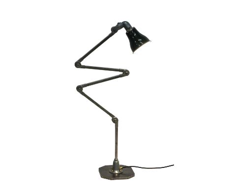 A British Invisaflex articulated four-section desk lamp,with a green enamelled shade,92cm high approximately, adjustableCondi