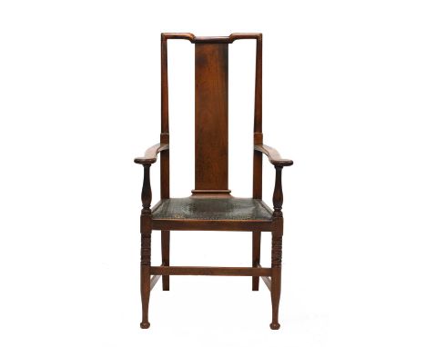 An Art Deco walnut elbow chair,in the Chinese style, with an embossed leather seat, with turned supports, 62cm wide58cm deep1