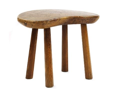 A Robert 'Mouseman' Thompson burr oak table,1950s, the burr shaped top, raised on tapering octagonal legs, with a carved mous