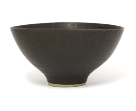 *Dame Lucie Rie (Austrian-British, 1902-1995),a stoneware bowl with a manganese ground, with a trailing glaze to the inside o