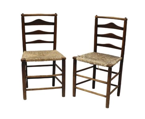 A pair of ash and elm ladderback side chairs, attributed to C R Ashbee (1863-1942) for the Guild of Handicraft, each with rus