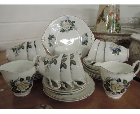 A part tea service by Regency with tea cups and saucers