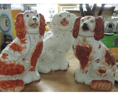 A selection of vintage ceramic Staffordshire flat back style dog figurines