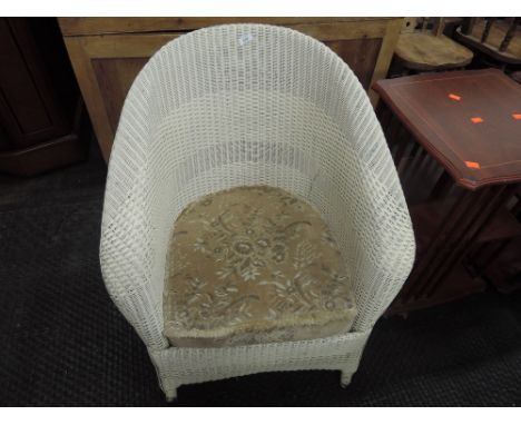 A vintage Lloyd loom tubchair