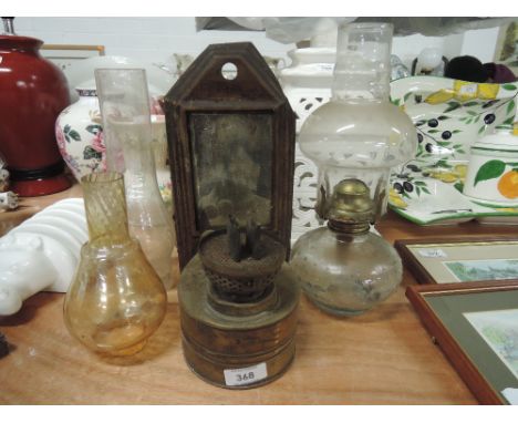 A selection of lamps including wall mounted brass wall lamp, glass reservoir lamp and shades