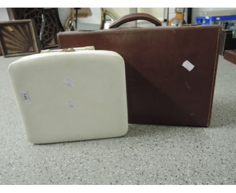 A vintage leather bound childs suitcase travel trunk and similar white vanity case