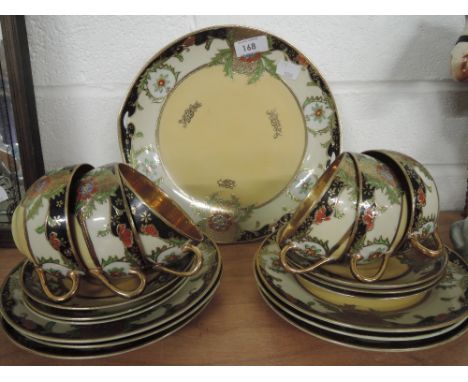 An ornate tea service with embossed and gilt pattern with an oriental influence