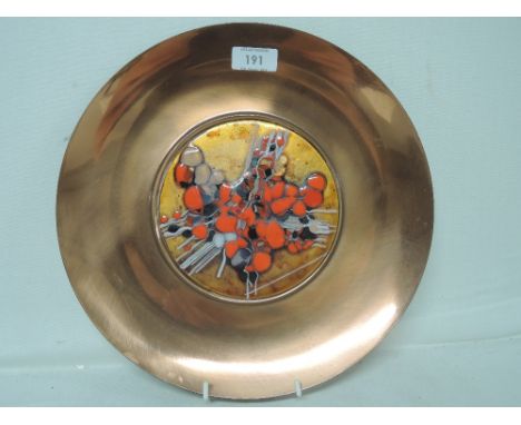 A copper and enamel art glass display plate with a Bohemian style