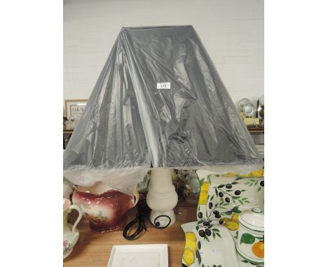 A large modern ceramic table lamp and shade