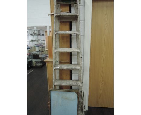 A vintage set of wooden step ladders and bed tray