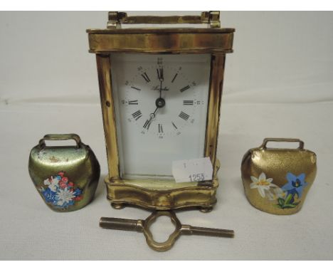A vintage Anfelus Carriage clock and two decorative bells