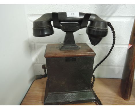 A vintage Ericsson crank telephone with cast and treen body