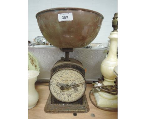 A vintage Huges kitchen scale with copper scale pan