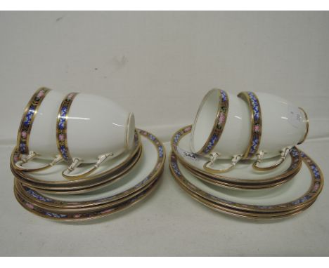 A part standard tea service white with gilt and floral edging approx 16pc