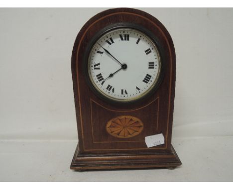 A small mantle clock by Buren Swiss made with veneer inlay