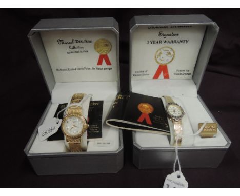A lady's gold plated wrist watch by Marcel Drucker having a baton numeral dial to oval face with diamond chip bezel and fixed