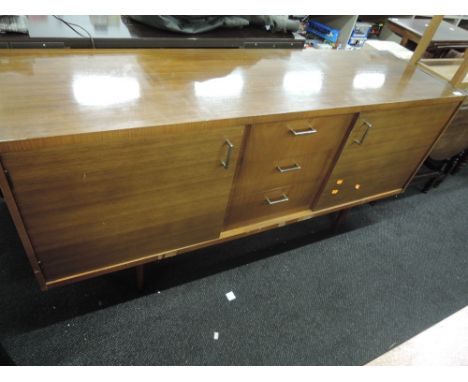 A vintage sideboard, labelled Wrighton, having revolving section