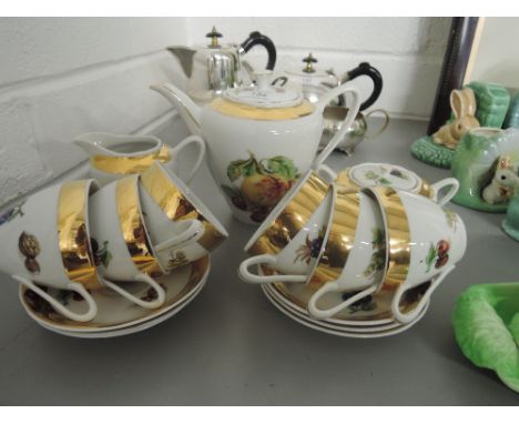 A part tea service with fruit transfer and gold gilt edge work 15 pieces