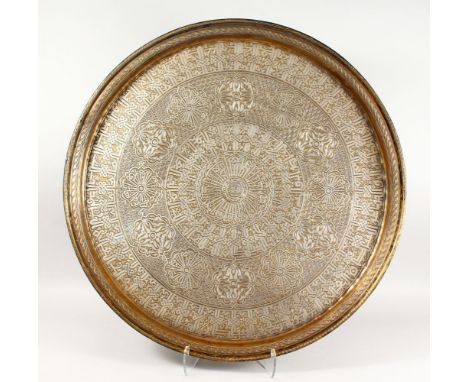 A MASSIVE 19TH CENTURY CAIROWARE EGYPTIAN OR SYRIAN SILVER OVERLAID CIRCULAR TRAY / CHARGER, engraved with large motif cartou