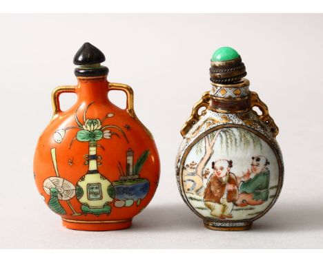 TWO 19TH / 20TH CENTURY CHINESE FAMILLE ROSE PORCELAIN SNUFF BOTTLES, one with a coral red ground with roundel panels depicti