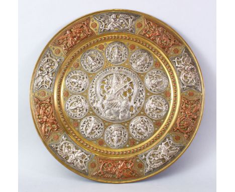 A LARGE INDIAN TANJORE SILVER &amp; COPPER OVERLAID BRASS TRAY, with many roundel's of gods / deity's / figures amongst flora
