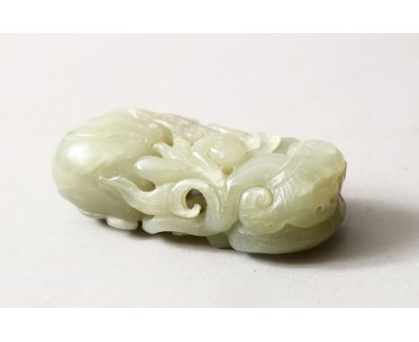 A GOOD QUALITY CHINESE CARVED JADE / HARD STONE FIGURE OF A MONKEY AND BATS AMONGST FRUITS AND FUNGHI, 8cm.