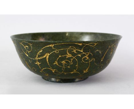 A FINE QUALITY 18TH / 19TH CENTURY ISLAMIC CARVED AND GILT DECORATED GREEN SPINACH JADE BOWL, the body of the bowl with incis