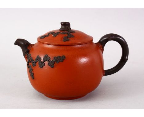 A CHINESE YIXING CLAY TEAPOT - PINE TREES, The base with an impressed seal mark, 9.5cm high x 15cm wide.