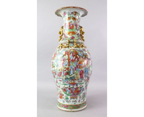 A LARGE 19TH CENTURY CHINESE FAMMILE ROSE CANTON PORCELAIN VASE, with panel decoration of figures interior, upon a white grou