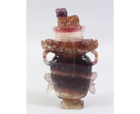 A 20TH CENTURY CHINESE CARVED AMETHYST VASE AND COVER, carved in 17th century style, 21.5cm high.