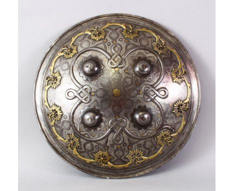 A VERY FINE INDIAN SILVER AND GOLD INLAID STEEL SHIELD, with raised stud decoration and onlaid motifs, 36.5cm diameter.