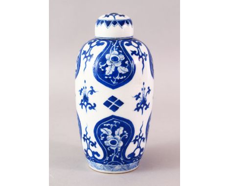 A FINE CHINESE KANGXI STYLE BLUE &amp; WHITE PORCELAIN TEA CADDY &amp; COVER, with panels of flora, the base with a six chara