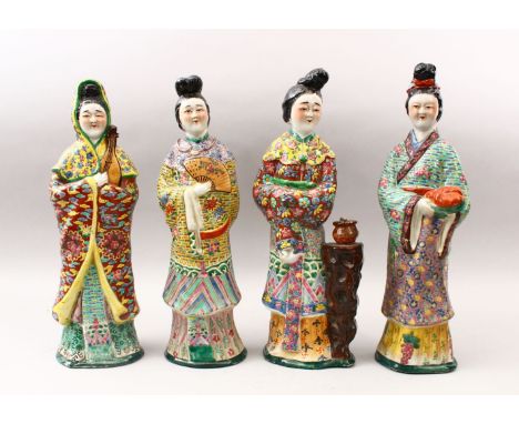 FOUR 19TH / 20TH CENTURY CHINESE FAMILLE VERTE / ROSE  PORCELAIN FIGURES OF LADIES, each finely decorated in an arrayt of col
