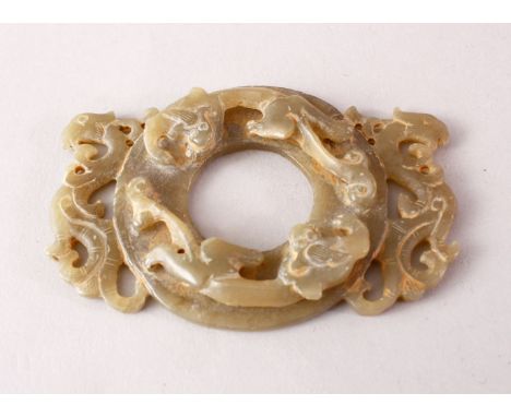 A CHINESE CARVED GREEN JADE CHILONG DISK / PENDANT, carved with chilong in archaic style, 9cm.