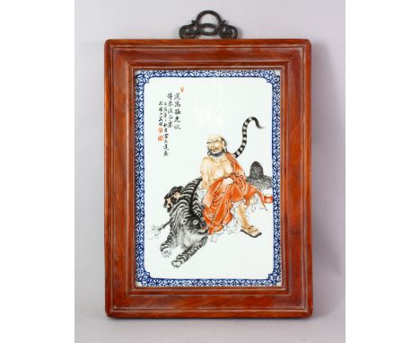 A GOOD CHINESE REPUBLIC STYLE FAMILLE ROSE PORCELAIN FRAMED PANEL OF ROHAN AND TIGER, the panel decorated to depict rohan sea