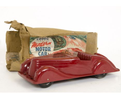 A Codeg Bakelite Modern Motor Car, reddish-brown Armstrong Siddeley style car, black wheels, clear plastic windscreen, transf