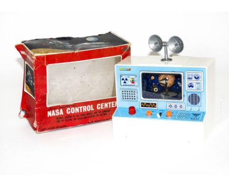 A Masudaya Modern Toys Battery-Operated NASA Control Center, detailed tinprinted console with white plastic surround, removab