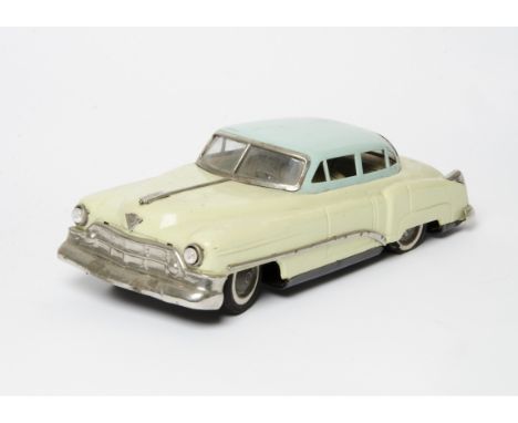 A 1950s Nikko/Nomura (T.N) Japan Large Scale Tinplate Cadillac, battery-operated model, pale yellow body, light blue roof, de