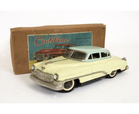 A 1950s Nikko/Nomura (T.N) Japan Large Scale Tinplate Cadillac, battery-operated model, pale yellow body, light blue roof, de