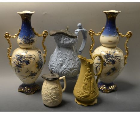 A Pair of Victorian Staffordshire two handled gourd shaped bottle vases, printed in blue and white with countryside flowers, 