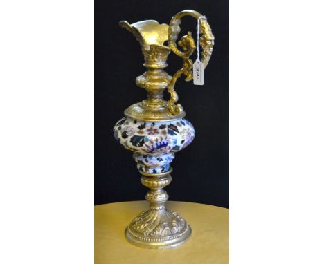 Hungarian gilt brass mounted ewer, the ceramic body glazed in the Persian taste, 49cm high