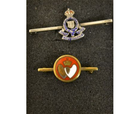 A Sterling and enamel Royal Army Ordnance Corp brooch; a silver gilt double heart brooch (2)