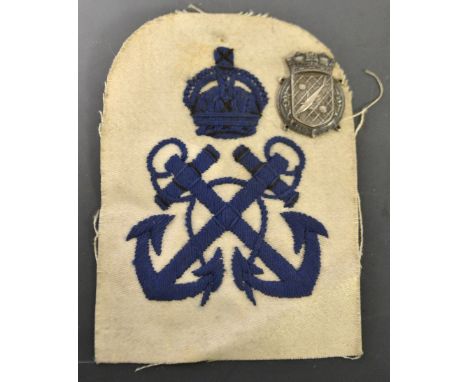 A minesweeper and anti submarine sleeve patch and silver badge